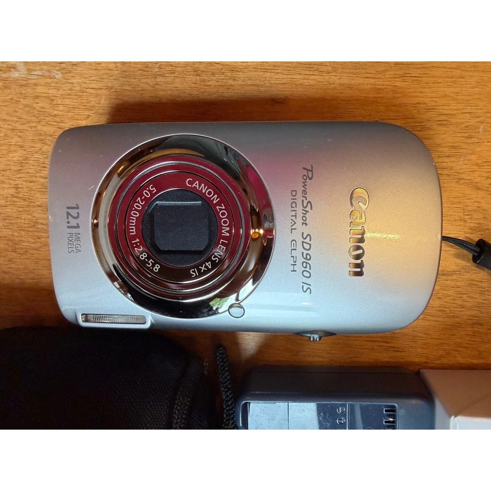 Canon Silver Digital Camera with Black Case and Charger